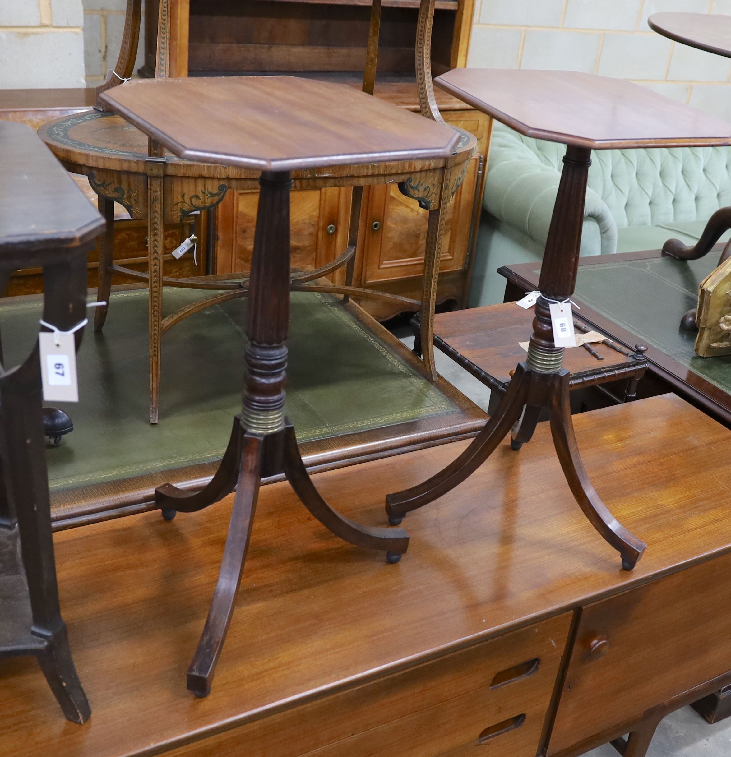 A pair of Regency style octagonal mahogany reeded column tripod wine tables, width 40cm, depth 36cm, height 75cm